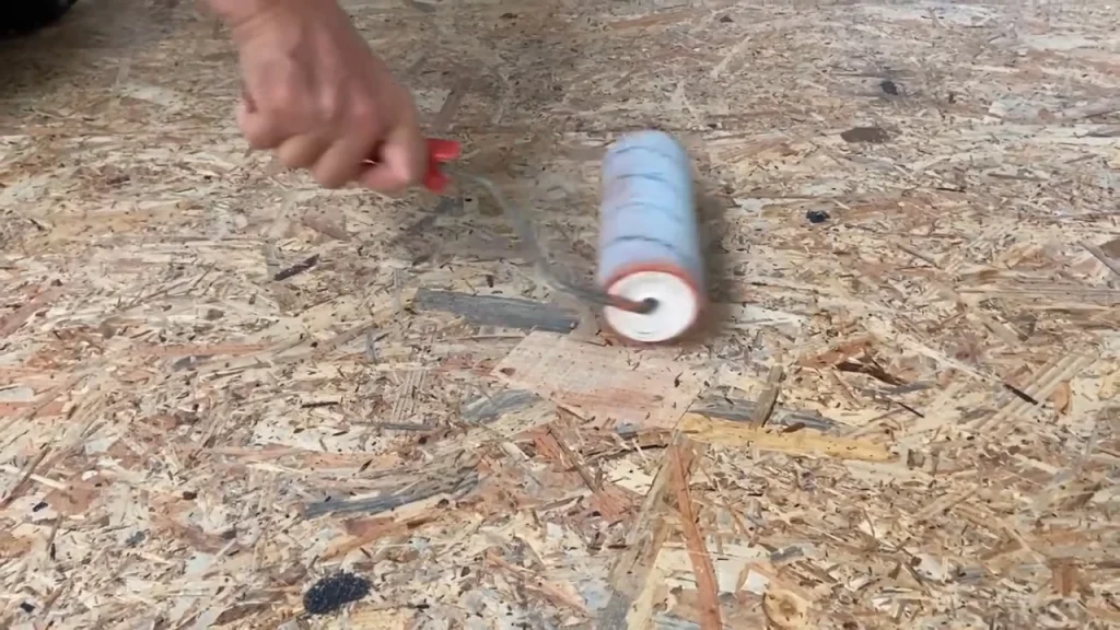 Application du primaire d'accrochage OSB